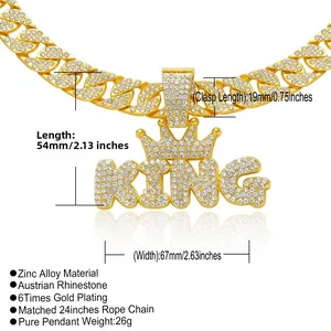 Detailed view of gold KING crown pendant with 2.63 inch width and iced out crystals