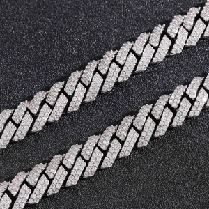 Macro detail of 10mm 925 silver Cuban link chain with hand-set pave moissanite diamonds