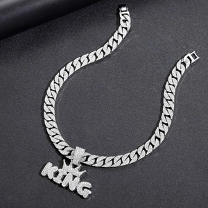 Silver iced out Cuban link chain with crown KING pendant and shimmering clear zircons