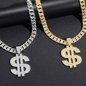 Detail of hip hop Cuban link necklaces with iced out dollar pendants in gold and silver