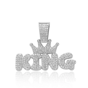 Macro shot of a silver KING pendant with crown and diamonds for hip hop necklaces