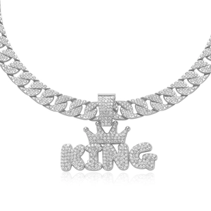 Iced out silver KING crown pendant on a sparkling Cuban link chain for men hip hop style