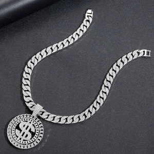 Hip hop silver dollar sign pendant with iced out Cuban link chain on black leather