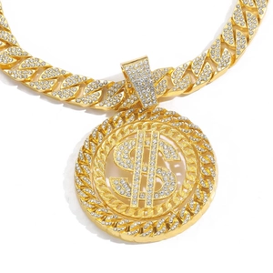 Macro detail of iced-out dollar sign pendant and cuban link chain with white zircons