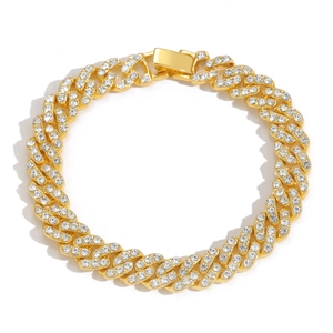 Close-up of 9mm gold-plated Cuban link chain with micro-paved rhinestones and folding clasp