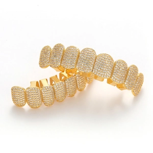 Detailed close-up of gold-plated hip hop grillz set with micro-paved cubic zirconia