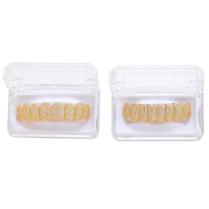 Iced out gold grillz with white zircons in a transparent jewelry display box