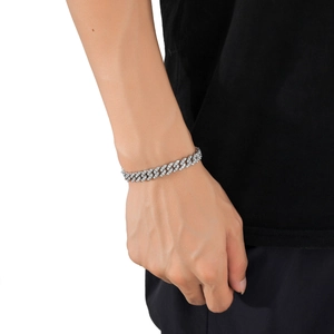 Detailed close-up of 9mm silver Cuban chain bracelet with paved sparkling zircons