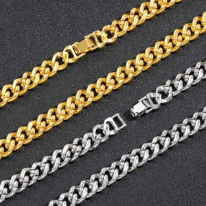 Detail of 9mm iced out gold and silver Cuban link chains with fold-over security clasps