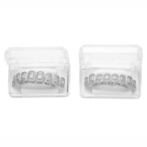 Close-up of hip hop silver grillz with zircon stones in a transparent display case