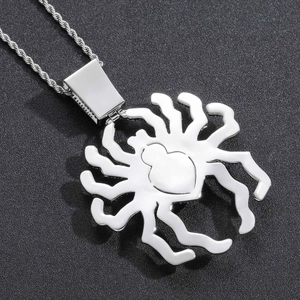 Macro view of hip hop oversized spider pendant with micro-pave zircons and rope chain