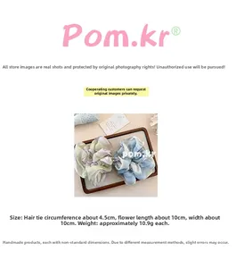 Detailed size chart showing 10cm diameter of blue and pink floral pattern scrunchies