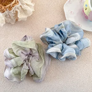 Floral organza scrunchies in gradient blue and purple with a pearlescent watercolor texture