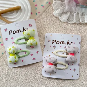 Floral print bow hair clips for girls featuring two pairs of sweet spring hair accessories
