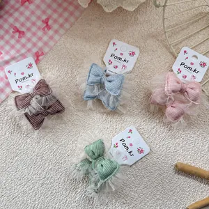 Lot de quatre jolis élastiques à nœuds en tulle pour filles en couleurs pastel
