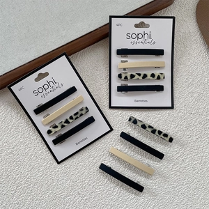 Détail lot de 4 barrettes à cheveux motif léopard et résine unie sur carton
