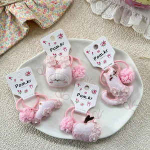 Pink plush kids hair scrunchies with cute animal embroidery and delicate lace details