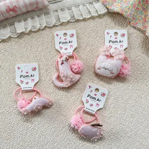 Sweet pink floral lace embroidery hair tie set for girls with cute pom-poms on a card