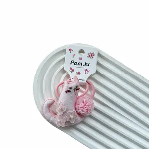 Pink cartoon cat hair tie with lace embroidery and floral details for girls