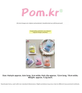 Detail view of colorful bow hair clips showing dimensions and back card packaging