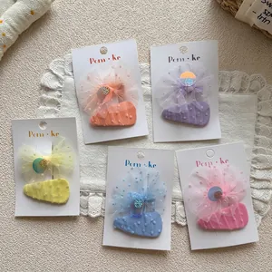 Five sets of sweet pastel butterfly bows and heart hair clips for girls on display cards