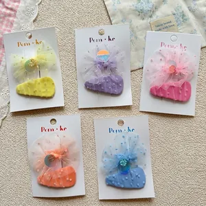 Five-color set of girl's purple fabric bow hair clips with sequins on a display card