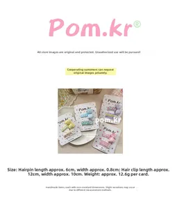 Detail of sweet floral and polka dot fabric bow hair clips for girls on display cards