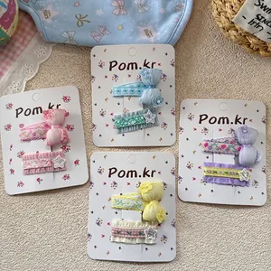 Sweet girl's hair clip set with floral bows and sequin stars in four pastel colors