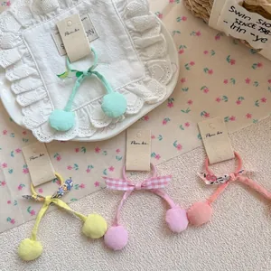 Élastiques à cheveux mignons de style coréen avec nœuds et pompons aux tons pastel
