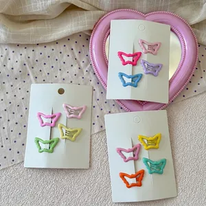 Set of colorful butterfly hair clips for kids in vibrant candy tones on display cards