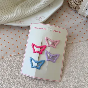 Set of four colorful butterfly hair clips for girls in soft macaron pastel shades