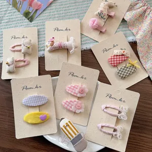 Pastel fabric bow hair clips with pearls and animal embroidery in multi-piece set