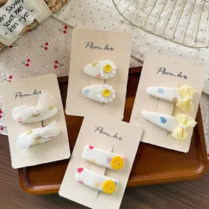 Set of 8 cute kids floral hair clips including daisies bows and button motifs