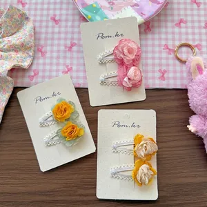 Three pairs of sweet chiffon flower hair clips with lace edges in pink yellow and orange