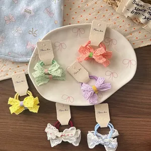 6er-Pack Haar-Accessoires mit Spitzen-Schleifen für Mädchen in Pastellfarben auf Teller