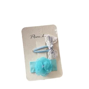 Handmade floral bow hair clip set featuring blue lace and chiffon hydrangea designs