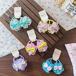 5 pairs of colorful lace mesh flower hair ties for girls with bows on a wooden base