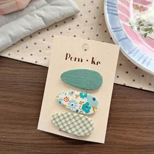 Set van drie stoffen haarspeldjes met bloemen- en ruitjespatroon voor meisjes