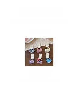 Detail view of cartoon animal hair ties set with cute embroidered fabric patches