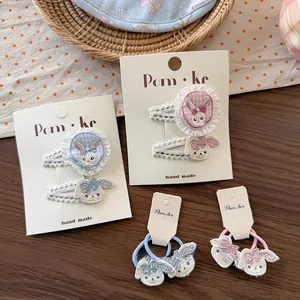 Détail de pinces à cheveux brodées lapin et accessoires en dentelle florale pour enfants