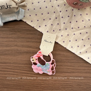 Detail of pink embroidered cartoon dog hair tie on high-elasticity fabric hair ring