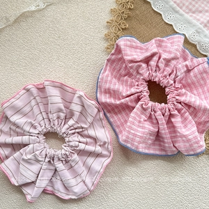 Striped pink and checkered blue oversized fabric scrunchies in a stylish Korean style