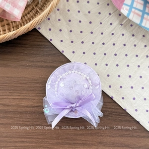 Detail of lavender sequin flower hat headband with delicate lace and pearl bead accents