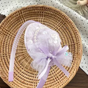 Detail of lavender sequin mini hat headband with pearls, lace and ribbon for girls