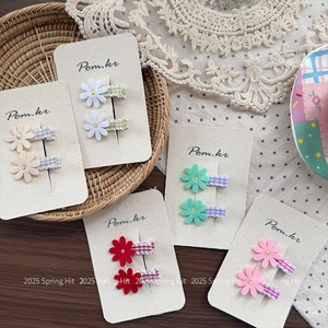 Floral hair claw clip set with daisy design and checkered fabric detail for women