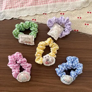 Set of five cute cartoon plaid scrunchies for girls in pastel colors with fabric patches