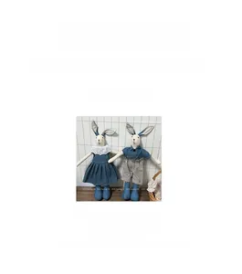 Detail of handmade cotton rabbit dolls in blue outfits, 42cm height and 113.7g weight