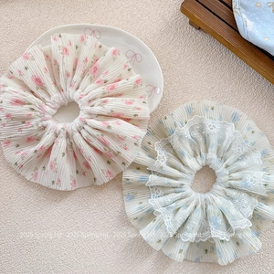 Pink and blue floral chiffon scrunchies with pleated texture and delicate lace edges