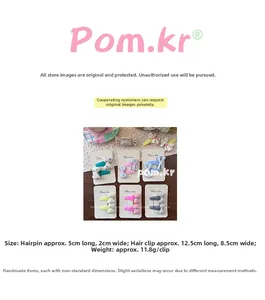 Detailed size parameters of polka dot bow hair clips showing 5cm length and fabric texture