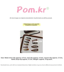 Detailed view of leopard print acetate hair clips in assorted geometric shapes